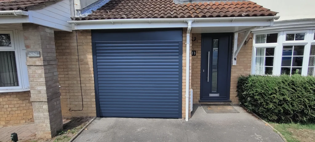 An anthracite roller garage door, electric roller garage door